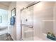 Modern bathroom showcasing a glass-enclosed shower with white tiled walls, and modern fixtures at 516 Red Lovebird Ave # Lot 1242, Henderson, NV 89011