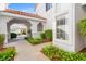 Landscaped walkway, covered entrance, and view of garages add curb appeal at 5201 S Torrey Pines Dr # 1221, Las Vegas, NV 89118