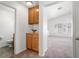 Hallway featuring a vanity, leading to a bright living space at 5201 S Torrey Pines Dr # 1221, Las Vegas, NV 89118