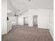 Spacious living room with carpet, ceiling fan, and open layout to other areas at 5201 S Torrey Pines Dr # 1221, Las Vegas, NV 89118