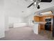 Open living area featuring vaulted ceilings, ceiling fan, and adjacent kitchen at 5201 S Torrey Pines Dr # 1221, Las Vegas, NV 89118