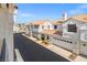 Street view showcases well-maintained townhomes with terra cotta tile roofs and attached garages at 5201 S Torrey Pines Dr # 1221, Las Vegas, NV 89118
