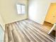 Minimalist bedroom design showcasing wood-look floors and neutral colors at 5250 S Rainbow Blvd # 2029, Las Vegas, NV 89118