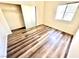Cozy bedroom with wood-look flooring, closet, and window at 5250 S Rainbow Blvd # 2029, Las Vegas, NV 89118