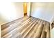 Another view of a bedroom with wood-look flooring and neutral paint at 5250 S Rainbow Blvd # 2029, Las Vegas, NV 89118