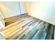 The light-filled bedroom has modern flooring, white walls, and convenient doorway access at 5250 S Rainbow Blvd # 2029, Las Vegas, NV 89118