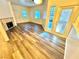 Bright living room with fireplace, wood-look flooring, and a sliding glass door at 5250 S Rainbow Blvd # 2029, Las Vegas, NV 89118