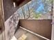 Private patio area with a textured wall and view of trees and sky, perfect for outdoor relaxation at 5250 S Rainbow Blvd # 2029, Las Vegas, NV 89118