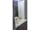 This bathroom features a sink with vanity, mirror, and storage cabinet at 5335 Rod Ct # 102, Las Vegas, NV 89122