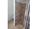 This bathroom features a tiled shower with glass door and a toilet at 5335 Rod Ct # 102, Las Vegas, NV 89122