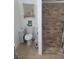 This bathroom features a toilet, walk-in shower with new shower head, and modern decor at 5335 Rod Ct # 102, Las Vegas, NV 89122