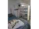 Comfortable bedroom featuring a bed, dresser, and large storage unit providing organizational options at 5335 Rod Ct # 102, Las Vegas, NV 89122