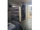 Bedroom featuring a bed, dresser, storage unit, and access to an en-suite bathroom at 5335 Rod Ct # 102, Las Vegas, NV 89122