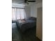 This bedroom features a cozy space with updated flooring, neutral colors, and natural light at 5335 Rod Ct # 102, Las Vegas, NV 89122