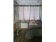 This bedroom features hardwood floors, storage cabinet, and stylish curtains at 5335 Rod Ct # 102, Las Vegas, NV 89122