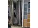 Walk-in closet with clothing racks and storage, concealed by a curtain, next to shelving units at 5335 Rod Ct # 102, Las Vegas, NV 89122