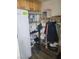 The closet has wooden cabinets, metal racking, clothes rack, and cleaning supplies at 5335 Rod Ct # 102, Las Vegas, NV 89122