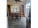 A dining area featuring laminate floors, display cabinets, and a table near the sliding glass doors at 5335 Rod Ct # 102, Las Vegas, NV 89122