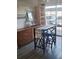 Comfortable dining area with dark wood table, stools, and a view of the outdoor area at 5335 Rod Ct # 102, Las Vegas, NV 89122