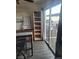 This dining area has laminate floors, display cabinets, and a table next to the glass door at 5335 Rod Ct # 102, Las Vegas, NV 89122