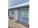 A cozy condo featuring wood paneling, security door, a double-paned window, and a small garden box window at 5335 Rod Ct # 102, Las Vegas, NV 89122