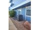 Exterior shot featuring vinyl siding, AC unit, and decorative landscaping at 5335 Rod Ct # 102, Las Vegas, NV 89122