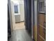 Hallway view into a bathroom, next to storage units offering accessibility and efficient space utilization at 5335 Rod Ct # 102, Las Vegas, NV 89122