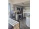 Modern kitchen with stainless steel appliances, gray cabinets, and stylish countertops at 5335 Rod Ct # 102, Las Vegas, NV 89122