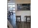 The kitchen features wood floors, an island, white cabinets, and stainless steel appliances at 5335 Rod Ct # 102, Las Vegas, NV 89122