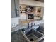 The kitchen bar area overlooks the living area, which features a fireplace and TV at 5335 Rod Ct # 102, Las Vegas, NV 89122
