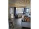 Cozy living room with a gray sofa, ambient lighting, and a view of the outdoors at 5335 Rod Ct # 102, Las Vegas, NV 89122
