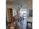 Inviting living area with wood flooring, dining set and access to patio at 5335 Rod Ct # 102, Las Vegas, NV 89122