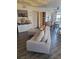 The living room area showcases a comfortable couch, storage unit, and wood laminate flooring at 5335 Rod Ct # 102, Las Vegas, NV 89122