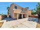 Backyard showing the large patio, home exterior, and mature trees at 5341 Cool Dawn Ct, Las Vegas, NV 89130