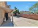 Spacious backyard patio with privacy wall, partially covered, and plenty of room for entertaining at 5341 Cool Dawn Ct, Las Vegas, NV 89130