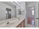 Bathroom featuring double sinks, tile floors, and a walk-in shower at 5341 Cool Dawn Ct, Las Vegas, NV 89130