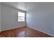 Bedroom featuring laminate floors and a window offering natural light at 5341 Cool Dawn Ct, Las Vegas, NV 89130
