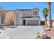 Inviting two-story home showcasing a well-maintained yard and ample driveway space at 5341 Cool Dawn Ct, Las Vegas, NV 89130