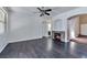 Spacious living room featuring a stone fireplace and dark wood floors at 5341 Cool Dawn Ct, Las Vegas, NV 89130
