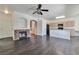 Inviting living area featuring a fireplace, wood floors, and a kitchen view at 5341 Cool Dawn Ct, Las Vegas, NV 89130