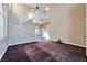 Open foyer with a staircase, chandelier, and carpeted floor at 5341 Cool Dawn Ct, Las Vegas, NV 89130