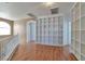 Open loft area with wood floors, recessed lights, and custom built-in bookshelves at 5341 Cool Dawn Ct, Las Vegas, NV 89130