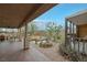 Large back porch and exterior entertaining area with landscaping at 603 Palmhurst Dr, Las Vegas, NV 89145