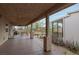 Large back porch with concrete flooring and decorative stone supports at 603 Palmhurst Dr, Las Vegas, NV 89145