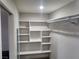Walk-in closet with built-in shelving, and clothing bar with chrome hangers at 603 Palmhurst Dr, Las Vegas, NV 89145
