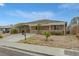 Charming single-story home featuring a cozy front porch, landscaped yard, and a paved driveway on a sunny day at 603 Palmhurst Dr, Las Vegas, NV 89145