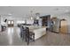 This wide-open kitchen features a granite island, stainless steel appliances, and an abundance of counter space at 603 Palmhurst Dr, Las Vegas, NV 89145