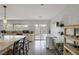 Kitchen area with granite counters, stainless steel appliances, and access to a bright backyard at 603 Palmhurst Dr, Las Vegas, NV 89145