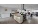 A spacious kitchen features a granite island with cooktop, opening to the dining and living areas at 603 Palmhurst Dr, Las Vegas, NV 89145