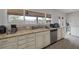 Kitchen area featuring granite countertops, stainless steel appliances, and a view of the covered patio at 603 Palmhurst Dr, Las Vegas, NV 89145